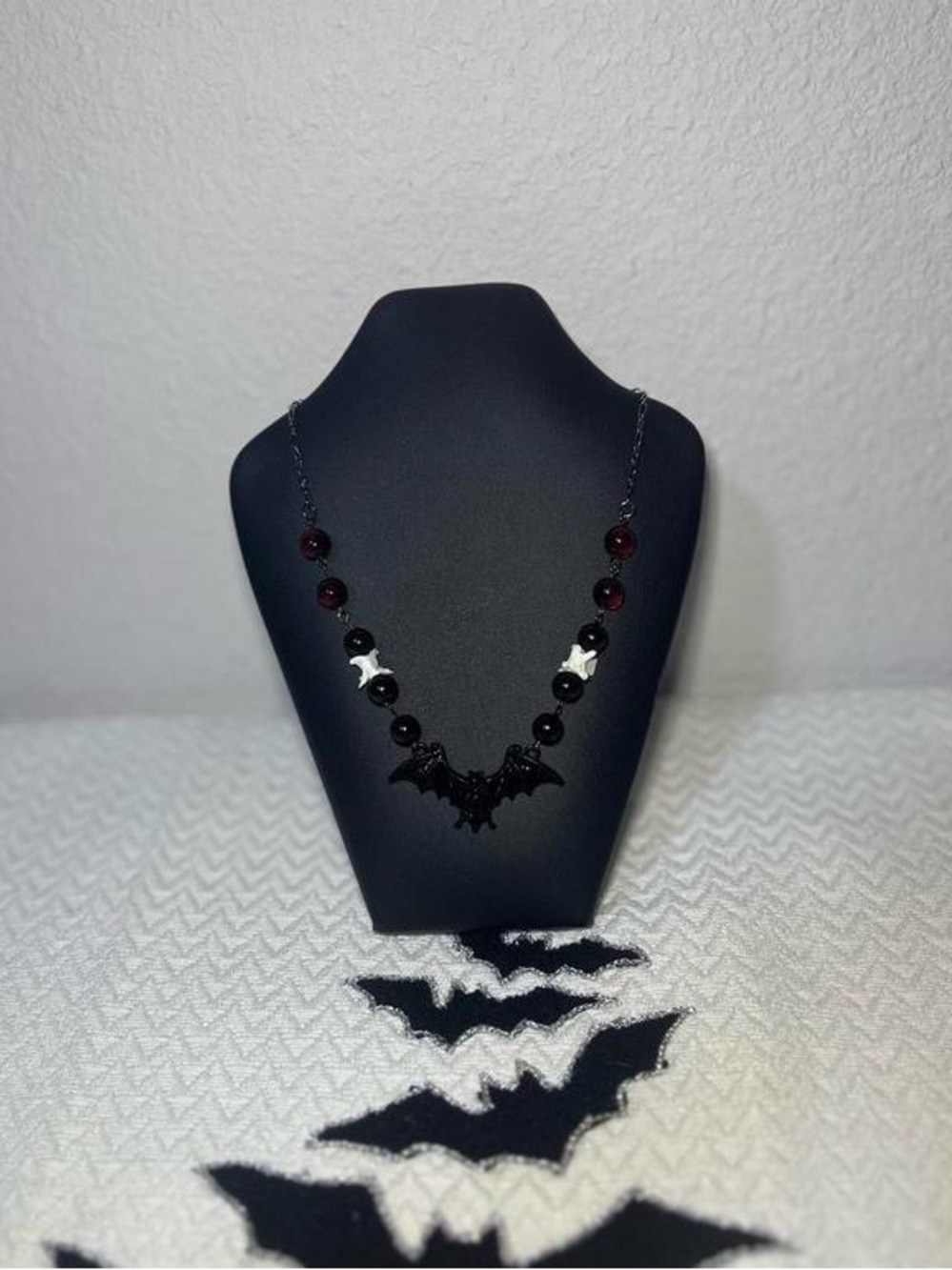 Handmade black/red beaded necklace with REAL snake vertebrae beads and bat charm